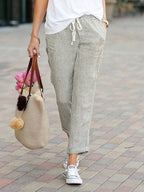 ZOFIA ATELIER beige linen-blend drawstring pants with a relaxed fit and cuffed ankles.