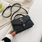 ZOFIA ATELIER Ewerina black PU leather crossbody bag with gold buckle detail and adjustable strap.