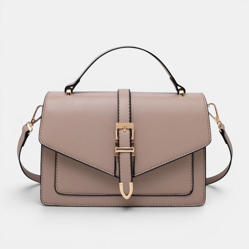 ZOFIA ATELIER Ewerina crossbody bag in taupe PU leather with gold buckle detail and top handle.