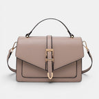 ZOFIA ATELIER Ewerina crossbody bag in taupe PU leather with gold buckle detail and top handle.