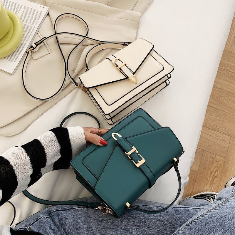 ZOFIA ATELIER Ewerina crossbody bag in teal PU leather with gold hardware and contrast trim. Features a structured design and a flap closure.