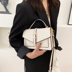 ZOFIA ATELIER Ewerina white PU leather crossbody bag with gold buckle and contrast trim. Street style.