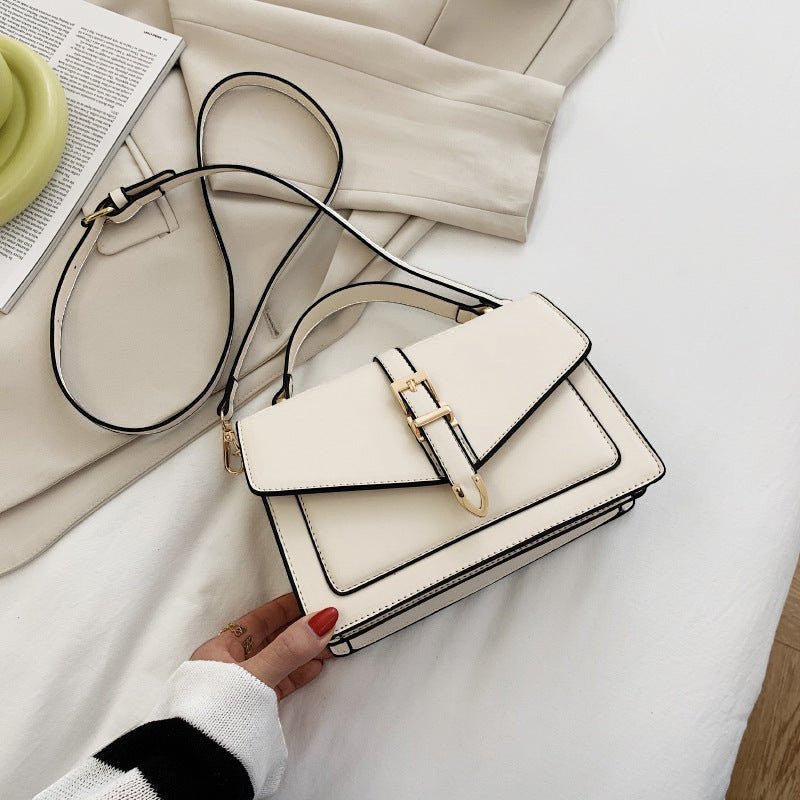 ZOFIA ATELIER Ewerina white PU leather crossbody bag with gold buckle and contrast trim. Street style.