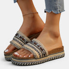 ZOFIA ATELIER Urszula Exotic Sandals with woven straps, studs, and a colorful striped platform sole.
