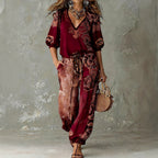 ZOFIA ATELIER FELICJA retro V-neck set with puff sleeves and full-length patterned pants in wine red and brown.