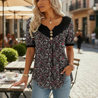 ZOFIA ATELIER floral print v-neck short sleeve top with button detail and flowy design.