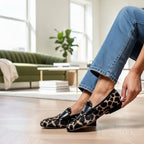 ZOFIA ATELIER women's tan and black giraffe print loafers with black trim and flat sole.