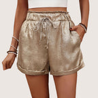 ZOFIA ATELIER gold hot pants with elastic waistband and drawstring, made of polyester.