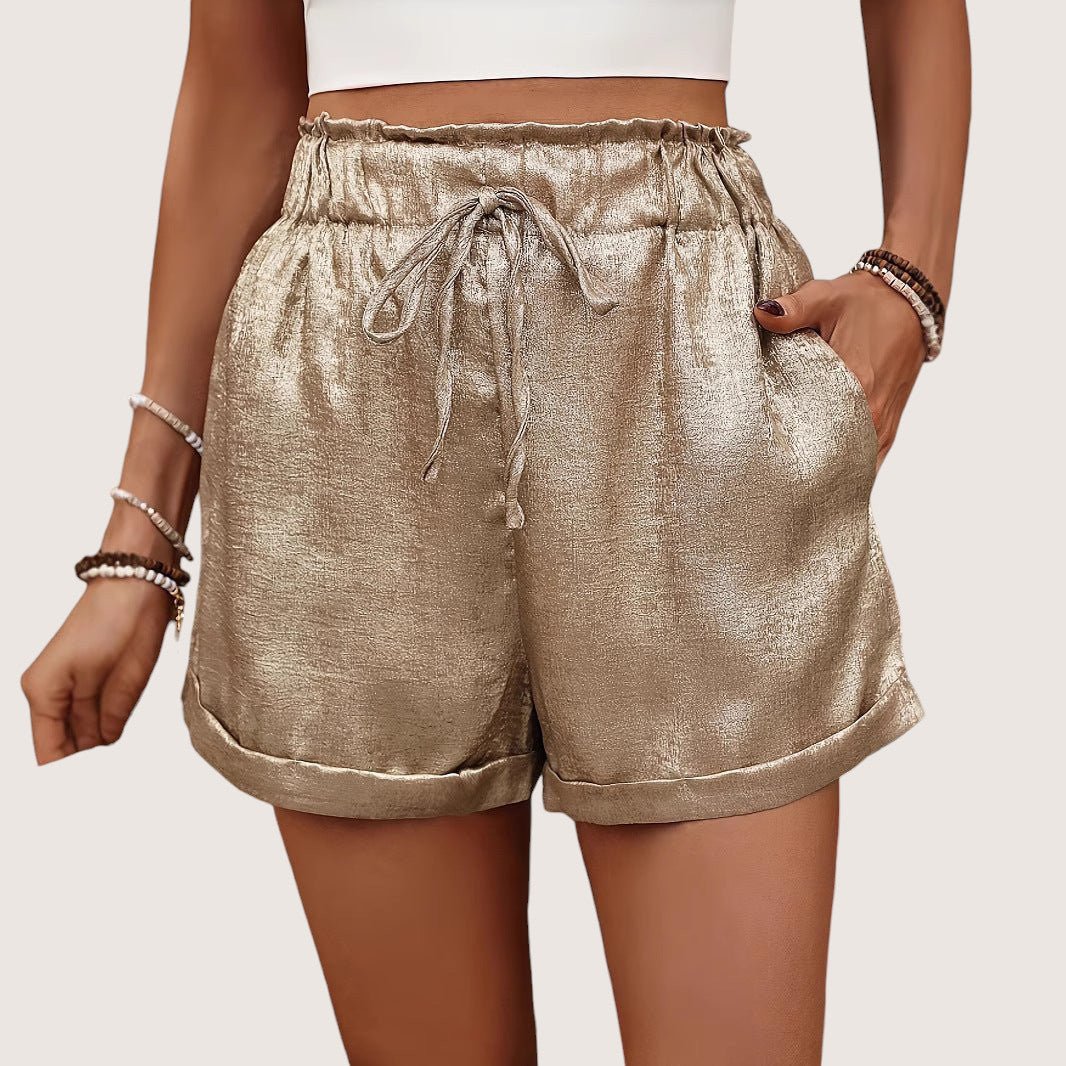 ZOFIA ATELIER gold hot pants with elastic waistband and drawstring, made of polyester.
