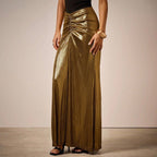 ZOFIA ATELIER gold pleated long skirt with ruched detail and side slit, made of polyester fiber.