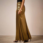 ZOFIA ATELIER gold pleated long skirt with ruched detail and subtle vertical stripes, made of polyester.