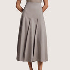 ZOFIA ATELIER gray polyester mid-length asymmetrical pleated skirt with a structured fit.