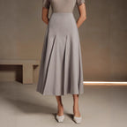 ZOFIA ATELIER gray polyester mid-length asymmetrical pleated skirt with a structured fit.