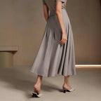 ZOFIA ATELIER gray polyester mid-length asymmetrical pleated skirt with a structured fit.