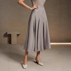 ZOFIA ATELIER gray polyester mid-length asymmetrical pleated skirt with a structured fit.