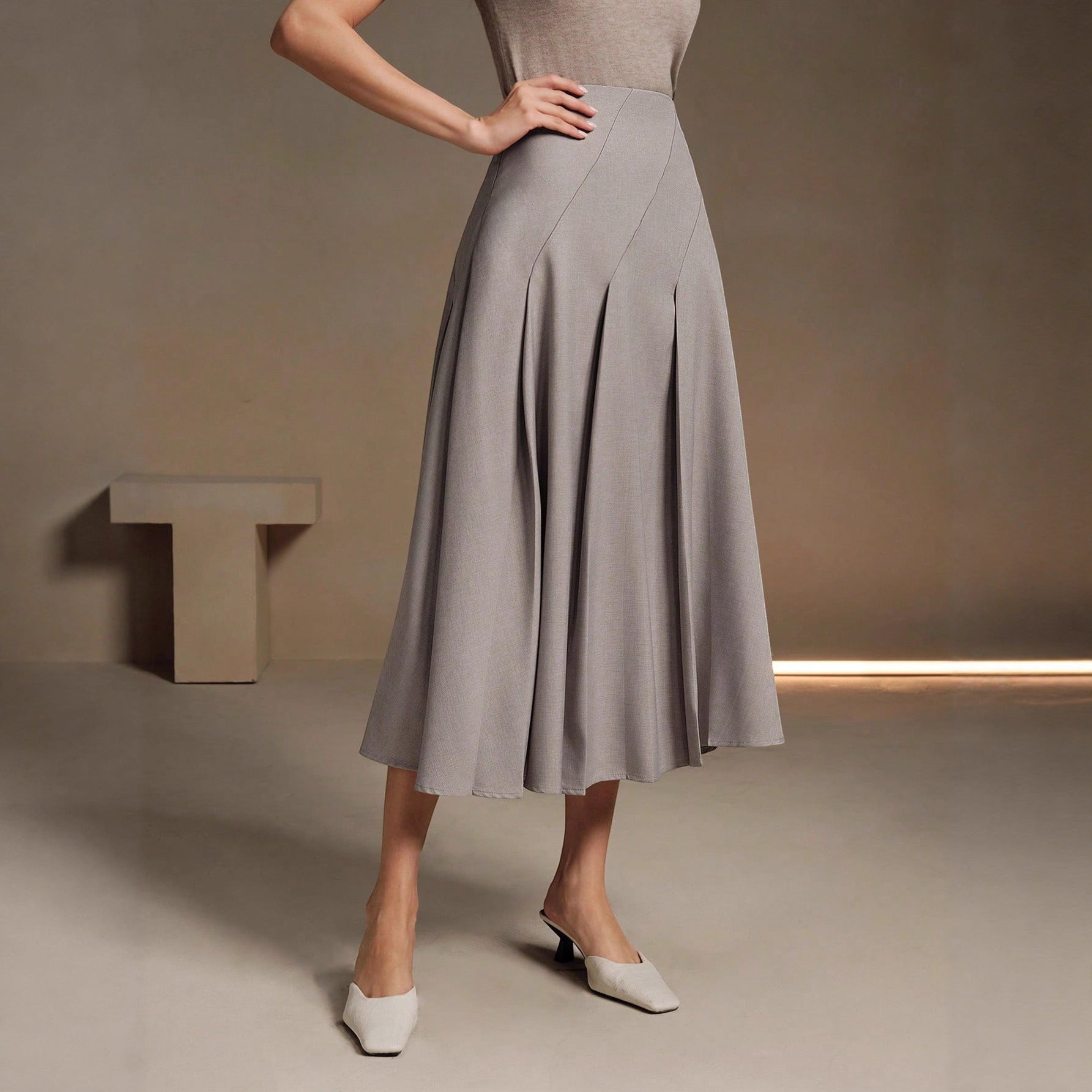 ZOFIA ATELIER gray polyester mid-length asymmetrical pleated skirt with a structured fit.