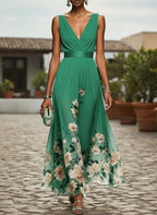 ZOFIA ATELIER sleeveless V-neck green floral print polyester gown with a high waist and flowing skirt.