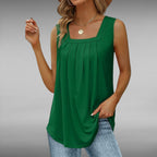 ZOFIA ATELIER green sleeveless square neck pleated blouse made of soft, flowing fabric.
