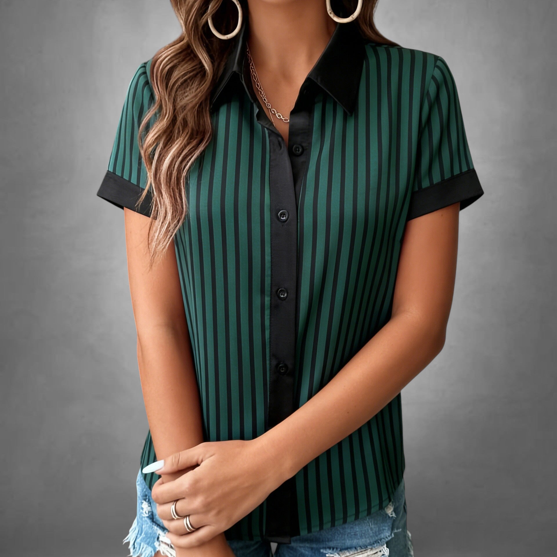ZOFIA ATELIER green and black striped short-sleeve polyester blouse with black collar and cuffs.