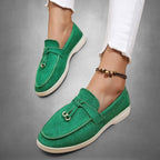 ZOFIA ATELIER green suede loafers with tassel detail and white sole. Women's slip-on shoes.