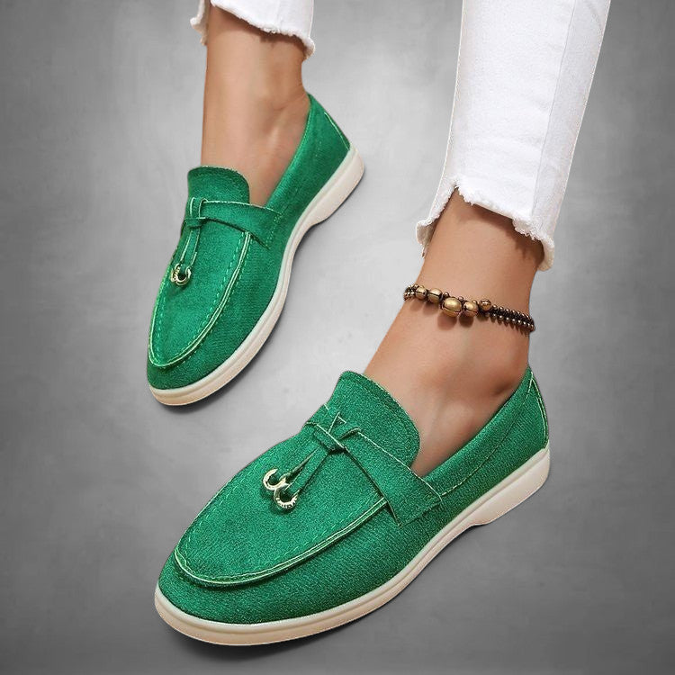 ZOFIA ATELIER green suede loafers with tassel detail and white sole. Women's slip-on shoes.