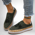 ZOFIA ATELIER dark green artificial PU tassel round toe flats with cork-effect sole and white trim.