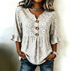 ZOFIA ATELIER grey short-sleeved polyester top with white daisy print, ruffled sleeves, and wooden buttons.