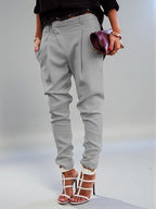 ZOFIA ATELIER light grey polyester blend high waist harem pants with a tailored fit and cuffed ankles.