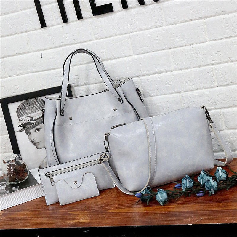 ZOFIA ATELIER light grey PU leather 3-piece bag set with medium bucket bag, crossbody bag, and wallet.