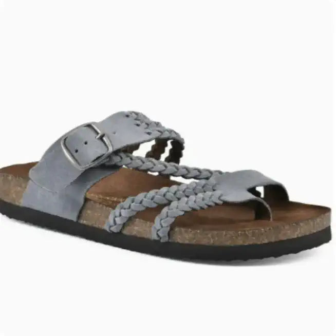 A single women's slide sandal with light gray suede straps, braided details, a silver buckle, a brown cork-look footbed, and a black outsole, shown on a plain white background.