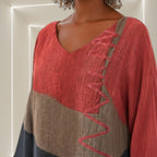ZOFIA ATELIER HALINA colorblock V-neck top in red, brown, and navy. Lightweight fabric with decorative zigzag stitching detail.