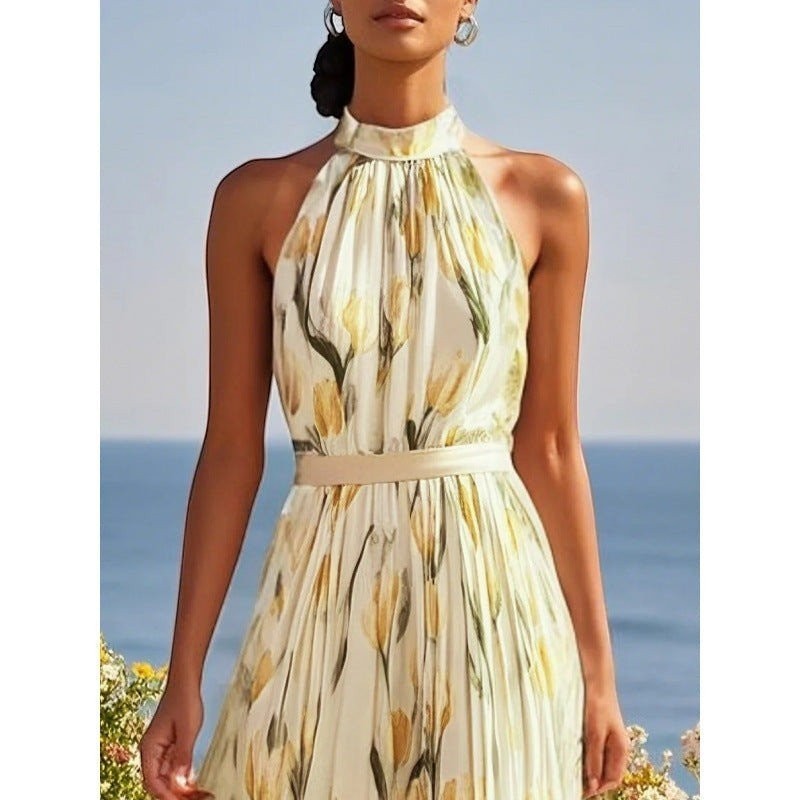 ZOFIA ATELIER WIKTORIA halter swing maxi dress with yellow floral print and belted waist.