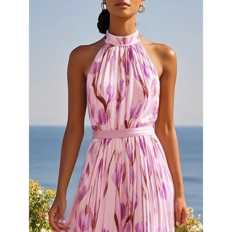 ZOFIA ATELIER WIKTORIA halter swing maxi dress in pink with purple floral print, flowing skirt, and belted waist.