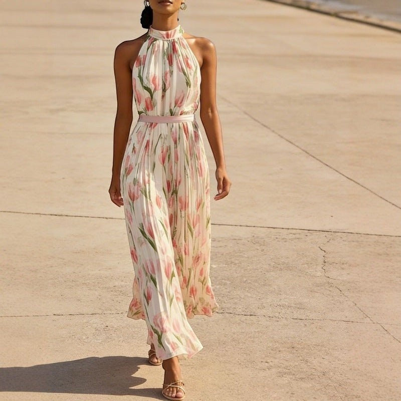 ZOFIA ATELIER WIKTORIA halter swing maxi dress with pink tulip print, pleated skirt, and pink sash.