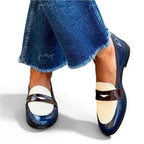 ZOFIA ATELIER HELENA classic slip-on loafers in navy blue patent leather with cream and brown accents.