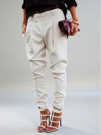 ZOFIA ATELIER high waist harem pants in off-white polyester blend, featuring a tailored fit and cuffed ankles.