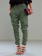 ZOFIA ATELIER high waist harem pants in olive green polyester blend, tailored fit, cuffed ankles.