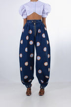 ZOFIA ATELIER high waist loose jeans in blue denim with white and orange polka dots, ankle ties.
