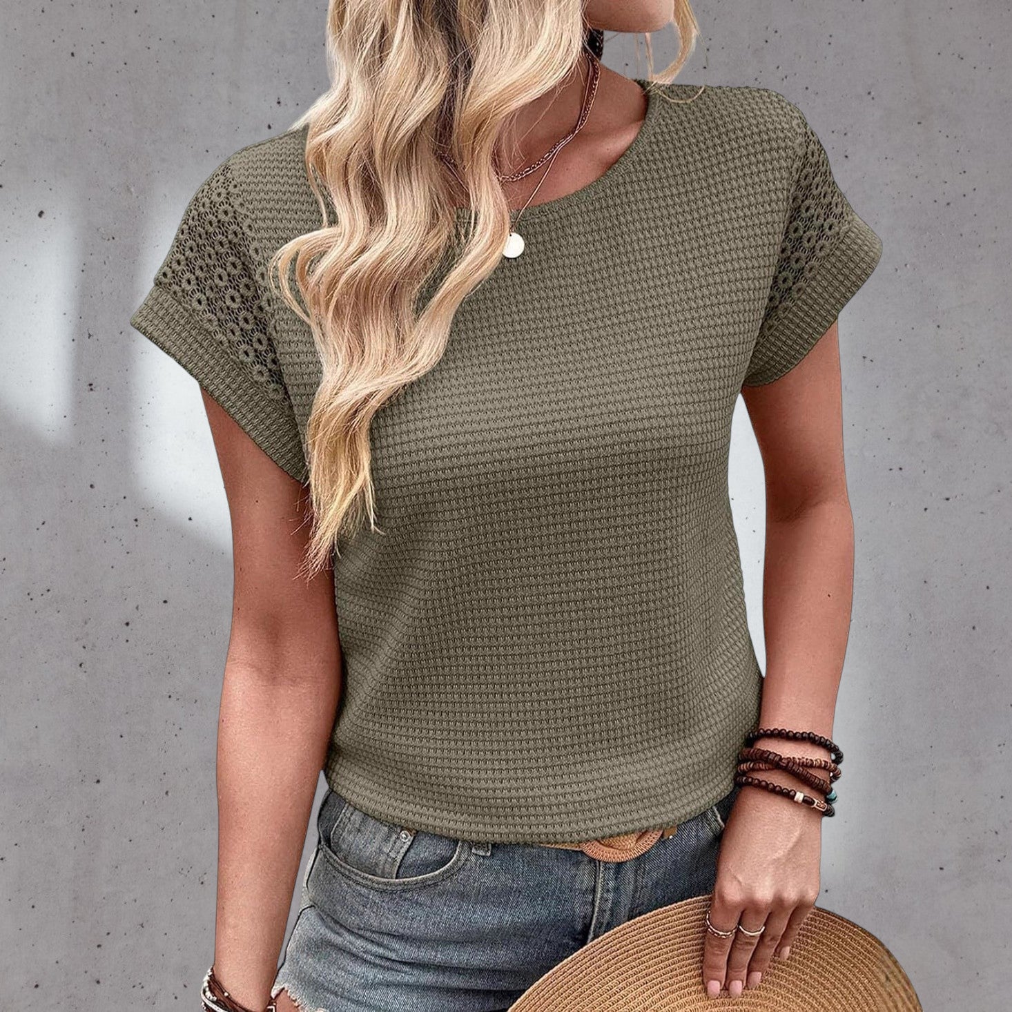ZOFIA ATELIER Isa crew neck short sleeve blouse in olive green waffle knit with lace detail on sleeves.