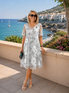 ZOFIA ATELIER ISABELLA dress: grey chiffon A-line skirt with white floral print, short sleeves, high waist. Elegant evening wear.