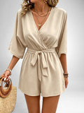 ZOFIA ATELIER Isabella V-neck beige polyester jumpsuit with tie waist and short legs.