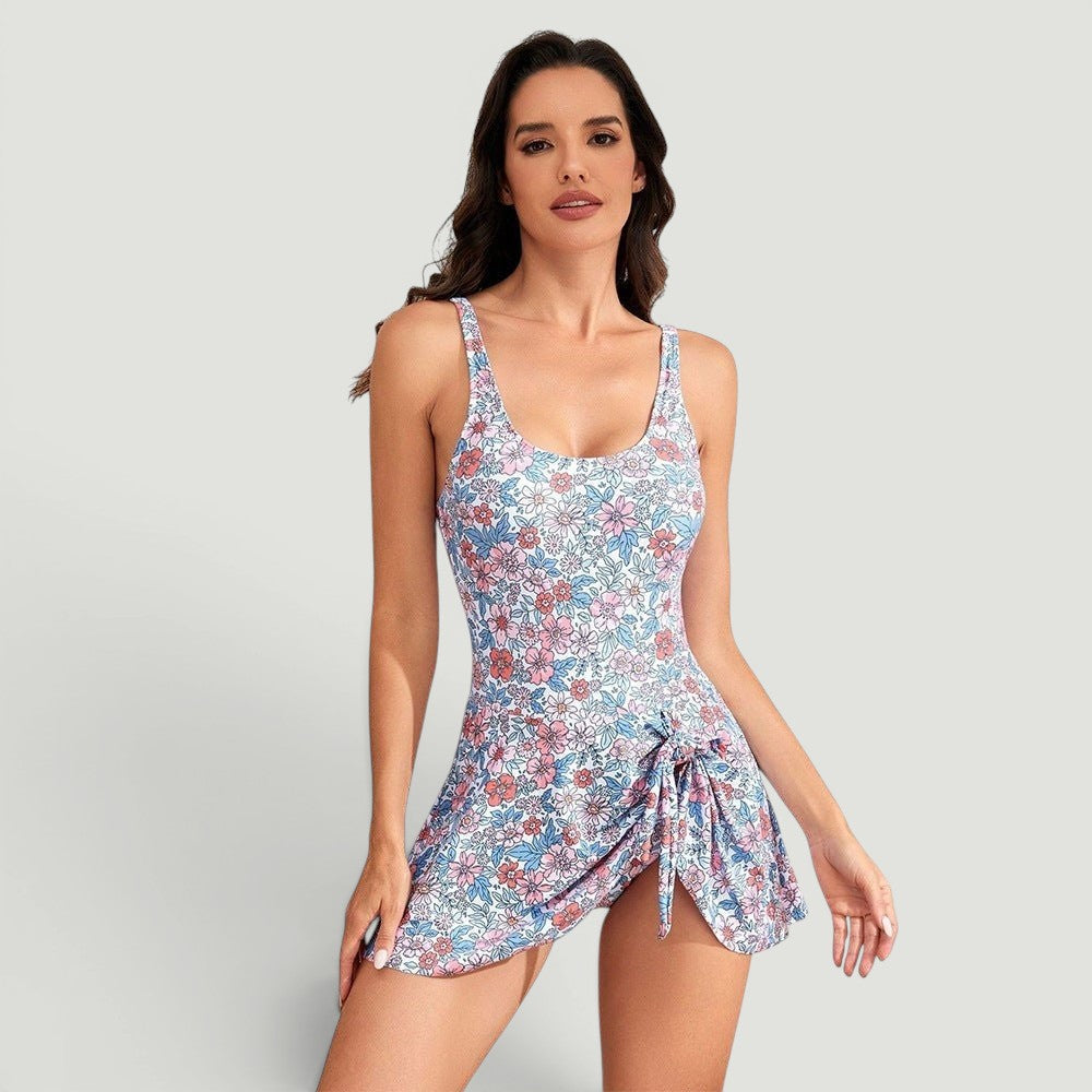 ZOFIA ATELIER IZA digital art floral print one-piece swimsuit with tie detail and skirt overlay