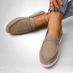 ZOFIA ATELIER Jadwiga taupe suede-style slip-on flats with a minimalist design and white sole.