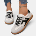 ZOFIA ATELIER JOANNA retro color-block sneakers in white, grey, and black PU with rubber sole.