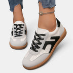 ZOFIA ATELIER JOANNA retro color-block sneakers in white, grey, and black PU with rubber sole.