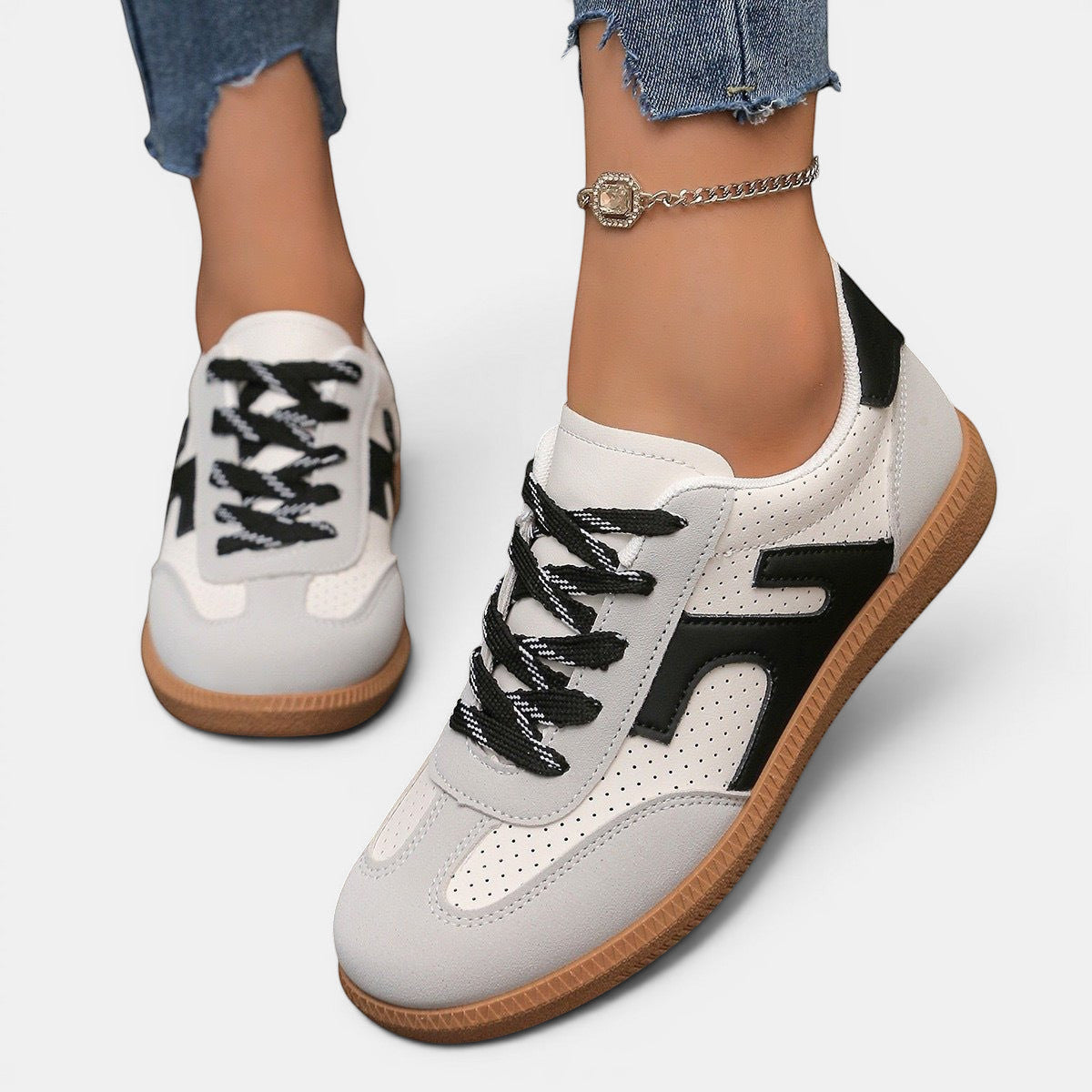 ZOFIA ATELIER JOANNA retro color-block sneakers in white, grey, and black PU with rubber sole.