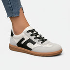 ZOFIA ATELIER JOANNA retro color-block sneakers in white, grey, and black PU with rubber sole.