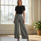 ZOFIA ATELIER JUSTYNA floral print wide leg pants in black and white polyester with a high waist.