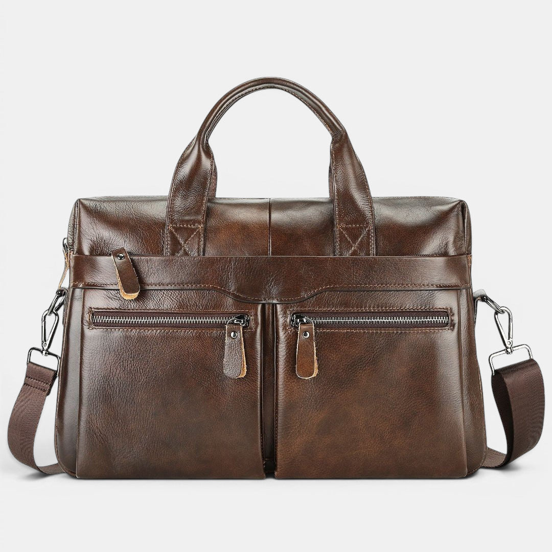 ZOFIA ATELIER KAROLINA minimalist brown leather handbag with double front zip pockets and top handles.