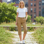 ZOFIA ATELIER khaki capri cargo pants with zippered pockets worn by a woman in a white t-shirt.